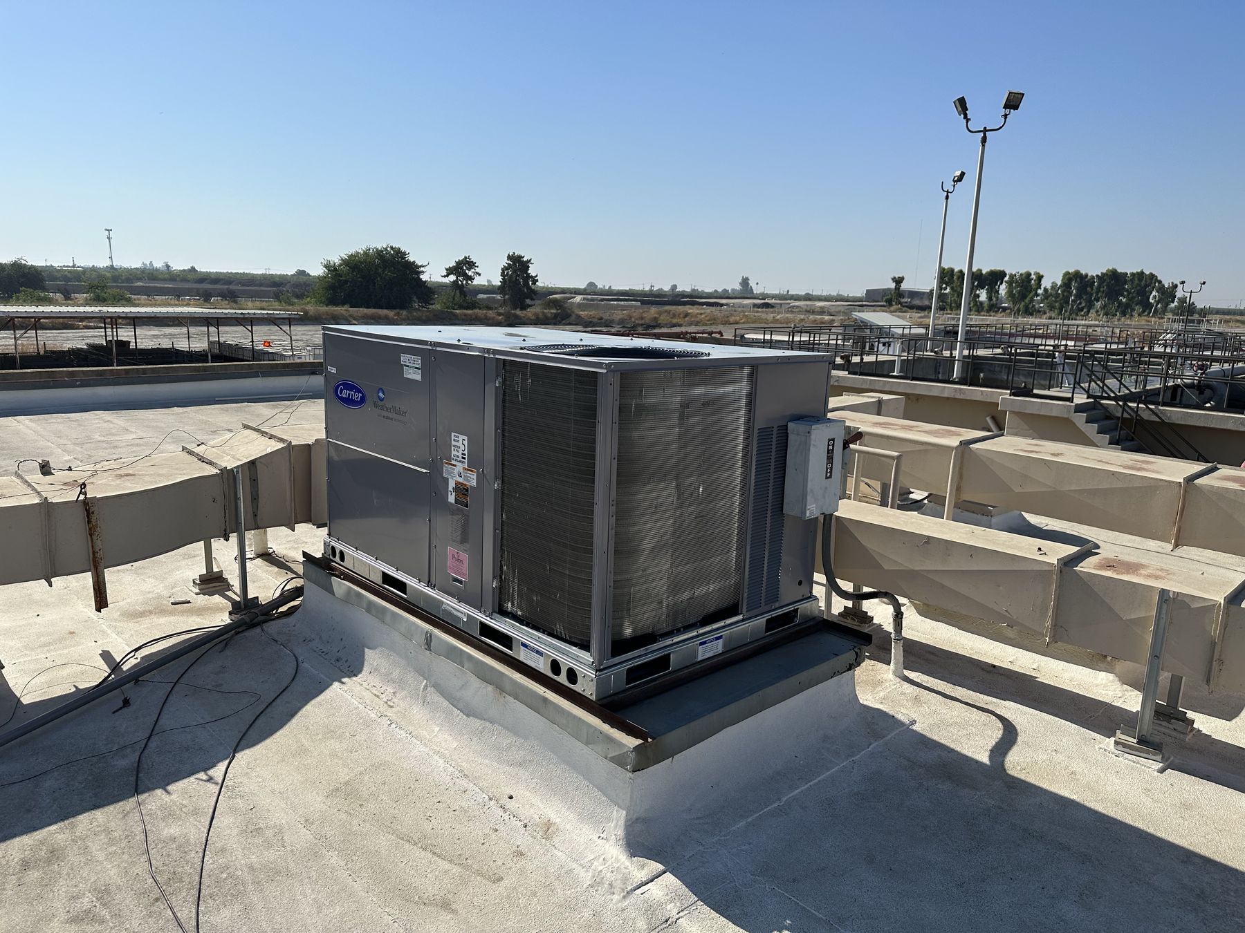 Rooftop package HVAC unit installed by JP Air Conditioning & Heating on a commercial building in Fresno