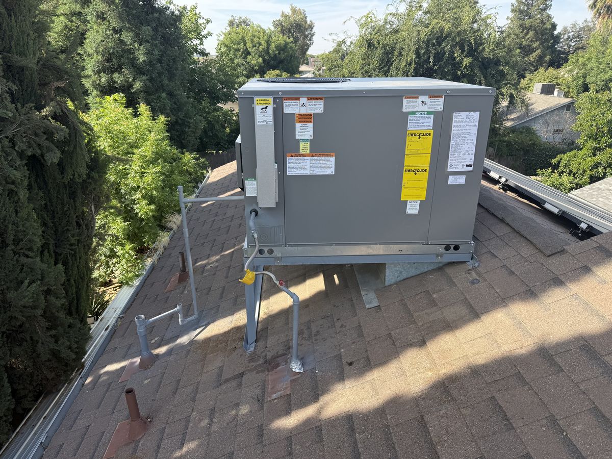New package unit installed on the roof of a Fresno home